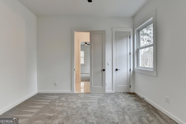 unfurnished bedroom with light carpet