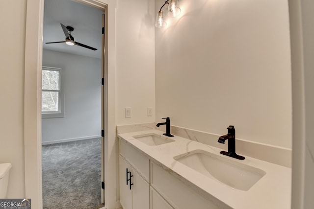 bathroom with ceiling fan and vanity