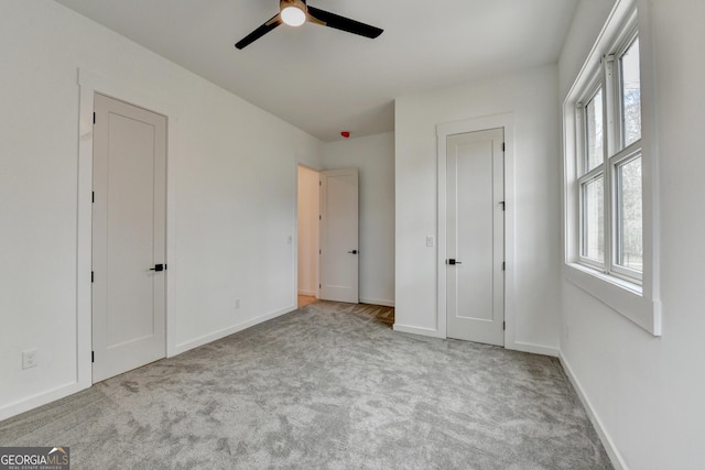 unfurnished bedroom with light carpet