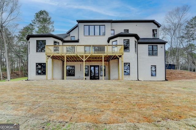 back of house featuring a wooden deck