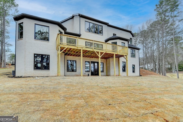 rear view of house featuring a deck