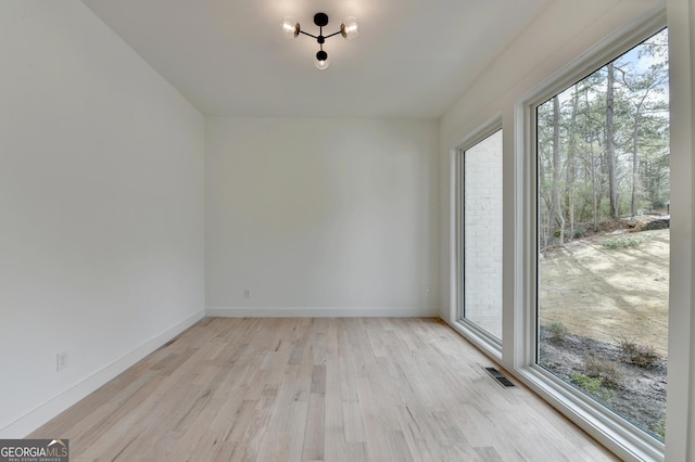 unfurnished room featuring light hardwood / wood-style flooring