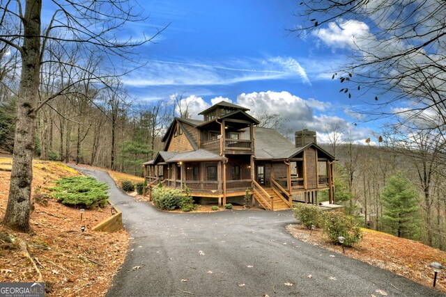 view of front of home with a sunroom