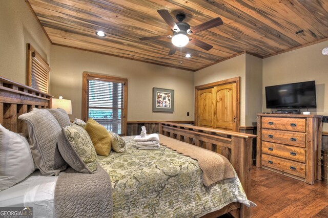 bedroom featuring ceiling fan, wooden ceiling, dark hardwood / wood-style floors, and ornamental molding