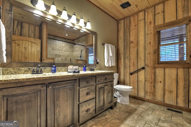 bathroom with vanity, wood walls, a shower, and wood ceiling