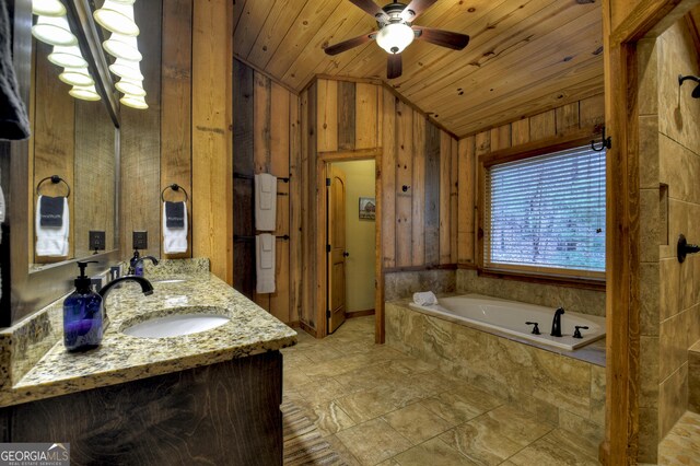 bathroom featuring vanity, lofted ceiling, wooden ceiling, ceiling fan, and tiled bath