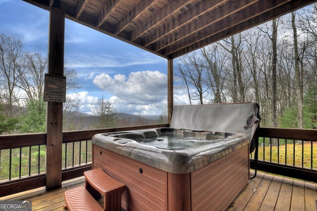 deck with a hot tub