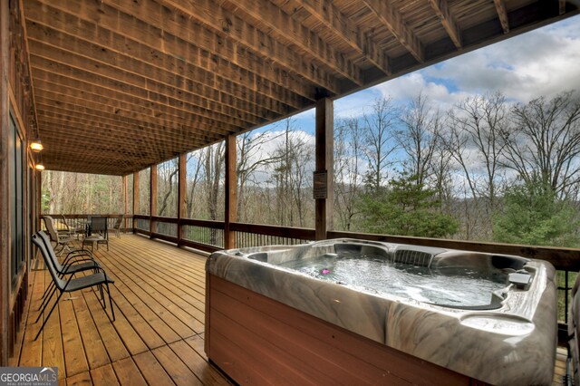 deck featuring a hot tub