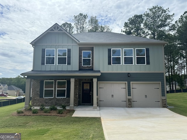 view of front of home featuring a porch, a garage, and a front yard