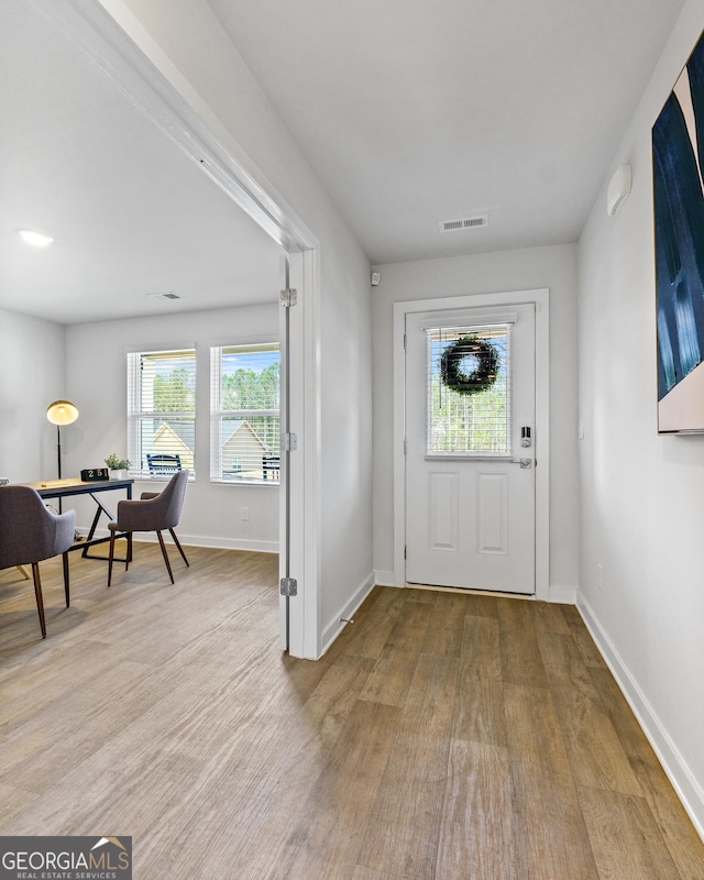 entrance foyer featuring a healthy amount of sunlight and light hardwood / wood-style floors