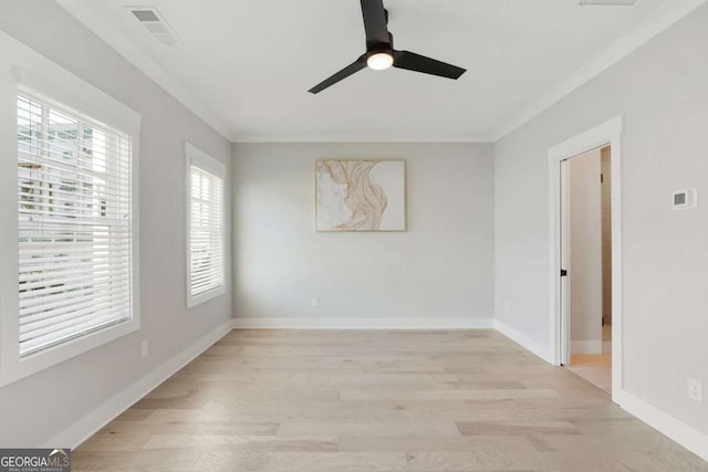 unfurnished room with ceiling fan, light hardwood / wood-style flooring, and crown molding