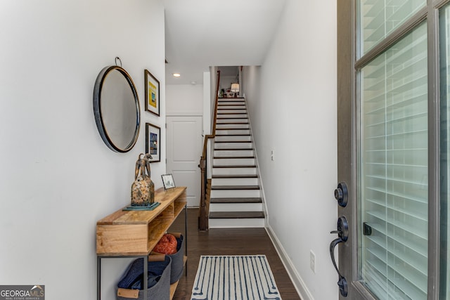 entrance foyer with dark hardwood / wood-style floors