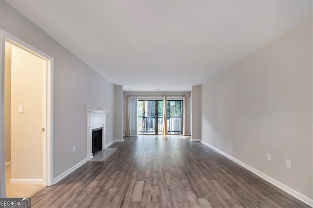 unfurnished living room with hardwood / wood-style flooring