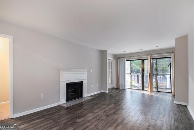 unfurnished living room featuring dark wood-type flooring