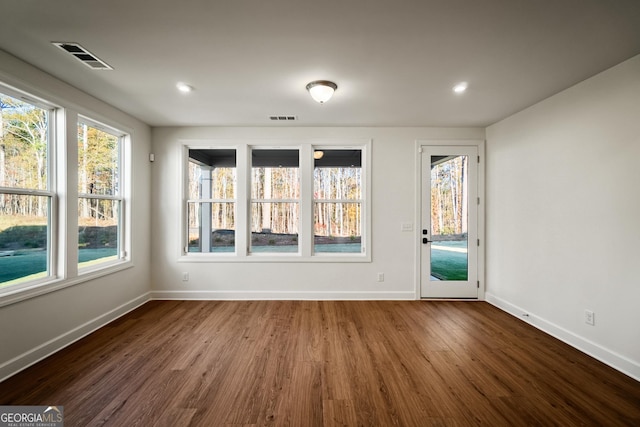 unfurnished room featuring hardwood / wood-style floors