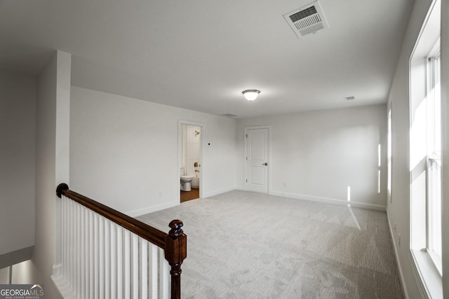 empty room featuring carpet floors