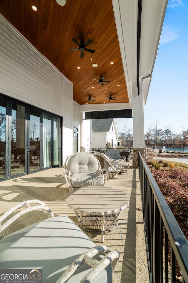 exterior space with ceiling fan