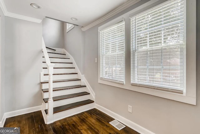 staircase featuring hardwood / wood-style flooring and ornamental molding