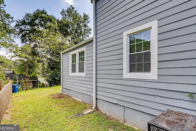 view of home's exterior featuring a yard