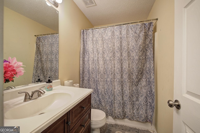 bathroom with curtained shower, vanity, a textured ceiling, and toilet