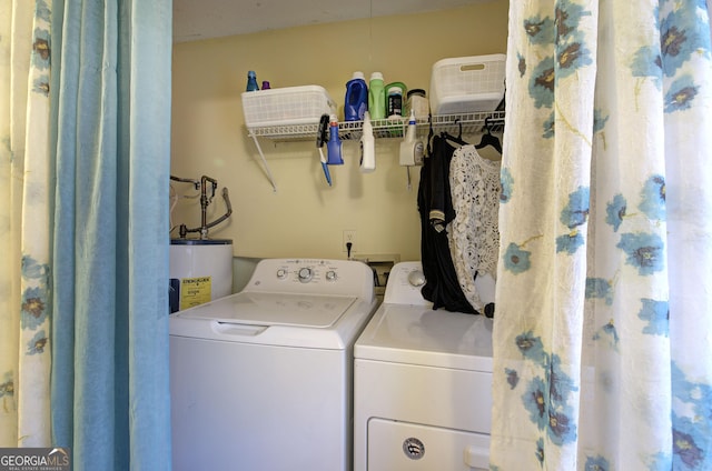 laundry area featuring separate washer and dryer and water heater