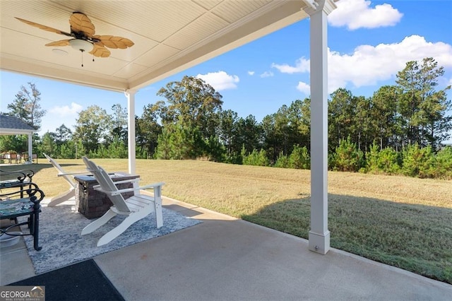 view of patio featuring ceiling fan