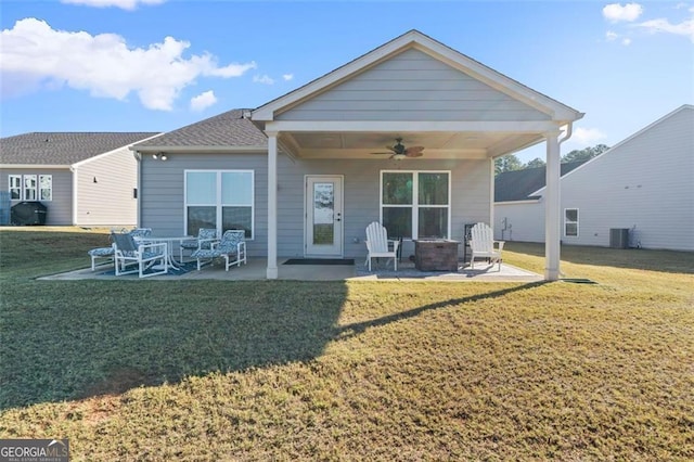 rear view of house featuring a yard, cooling unit, ceiling fan, and a patio area