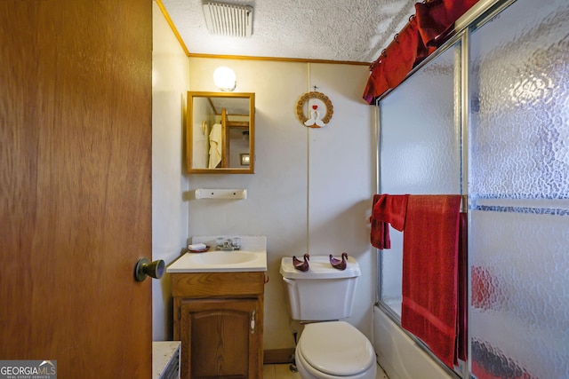 full bathroom featuring vanity, crown molding, toilet, enclosed tub / shower combo, and a textured ceiling