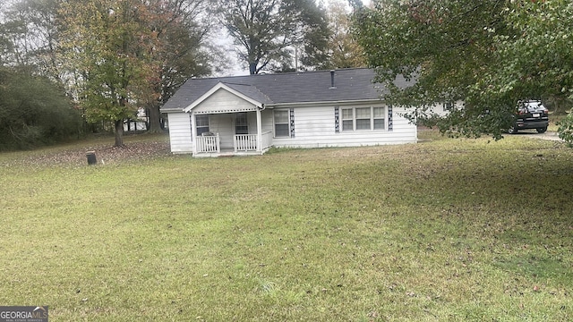 ranch-style house featuring a front yard and a porch