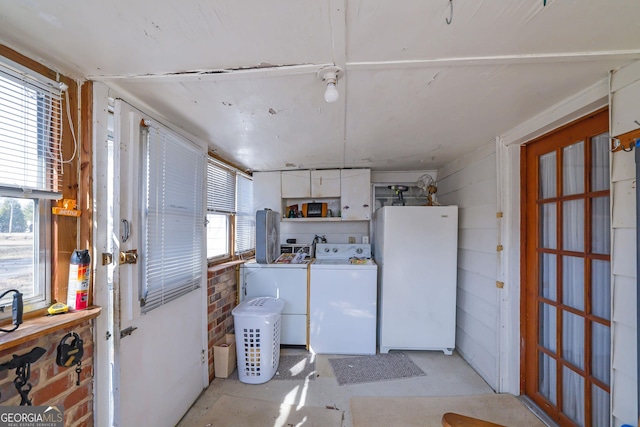 kitchen with separate washer and dryer, white cabinetry, and white fridge