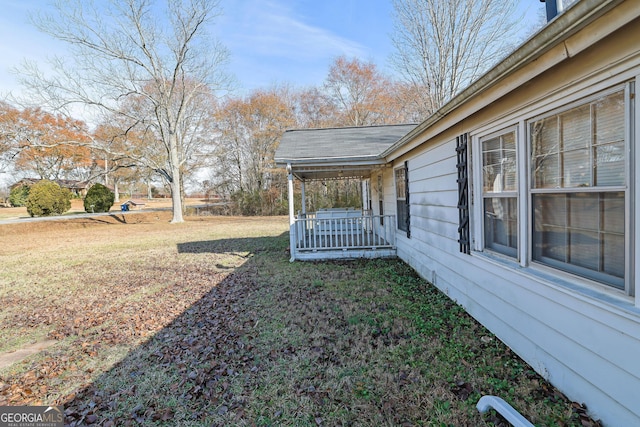 view of yard with covered porch