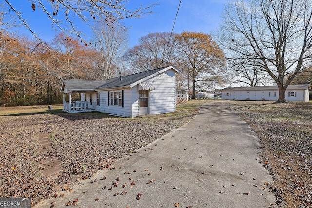 view of property exterior with covered porch