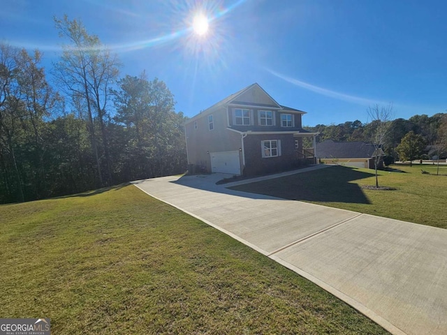 traditional home with driveway, a garage, and a front lawn