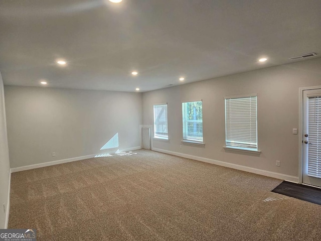 spare room with baseboards, carpet flooring, and recessed lighting