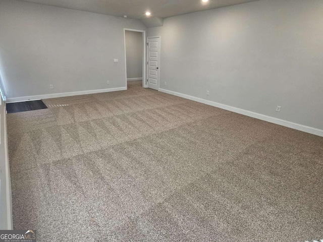 carpeted empty room featuring recessed lighting and baseboards