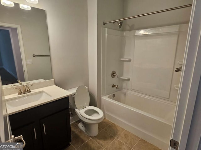 bathroom with  shower combination, tile patterned flooring, vanity, and toilet