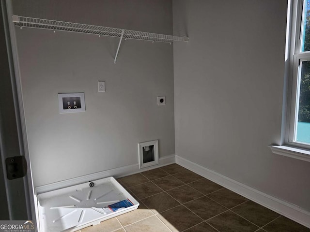 washroom with laundry area, washer hookup, dark tile patterned floors, baseboards, and electric dryer hookup