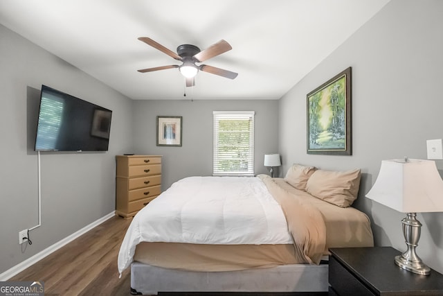 bedroom featuring ceiling fan and dark hardwood / wood-style flooring