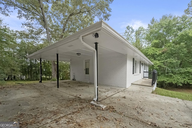 view of home's exterior with a carport