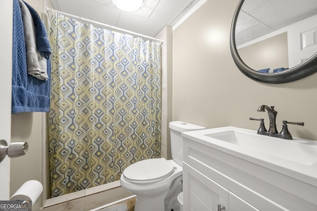 bathroom featuring vanity, toilet, and walk in shower