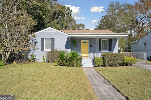 bungalow-style home featuring a front yard