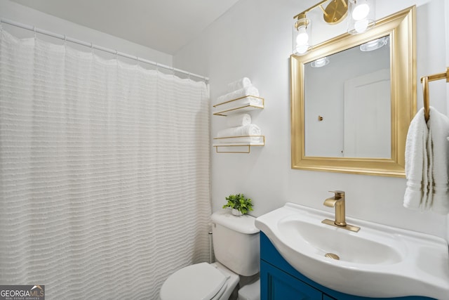 bathroom featuring vanity and toilet