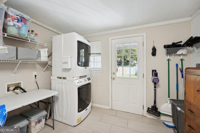 laundry room with stacked washer / drying machine, wood ceiling, and ornamental molding