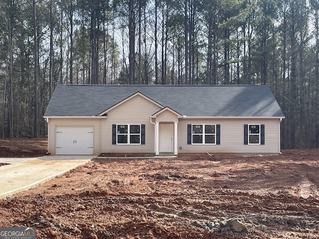 single story home featuring a garage