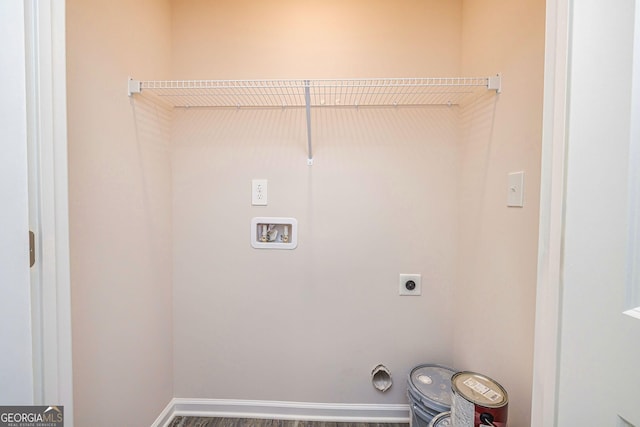 clothes washing area with laundry area, baseboards, washer hookup, and hookup for an electric dryer