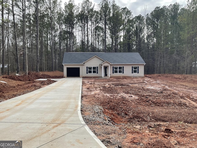 ranch-style home with a garage