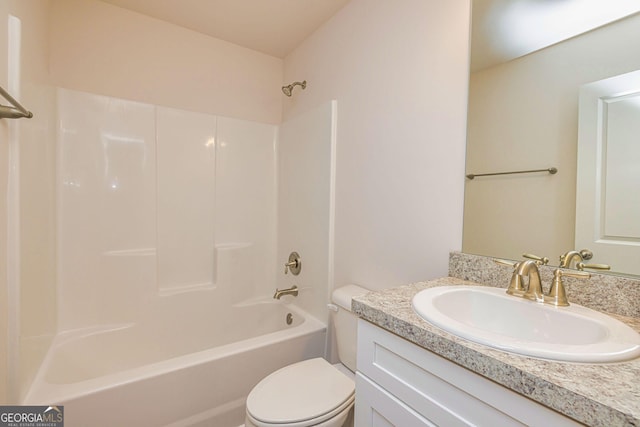 full bathroom with shower / tub combination, vanity, and toilet