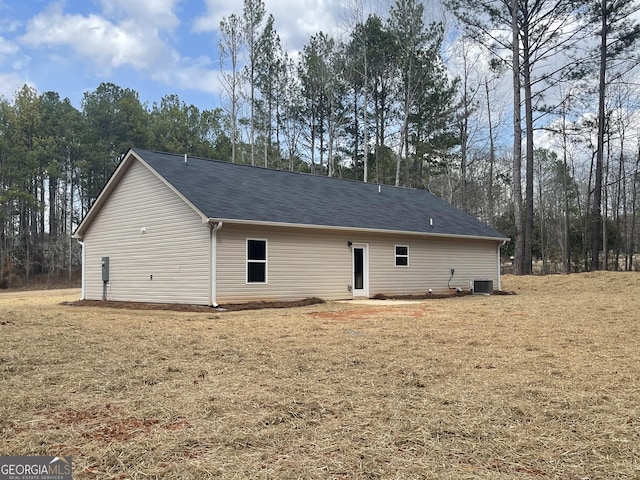 back of house featuring central AC unit