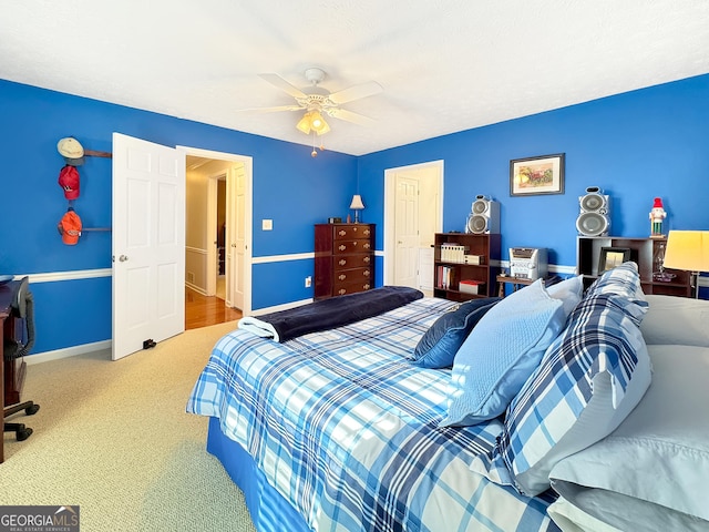 carpeted bedroom featuring ceiling fan