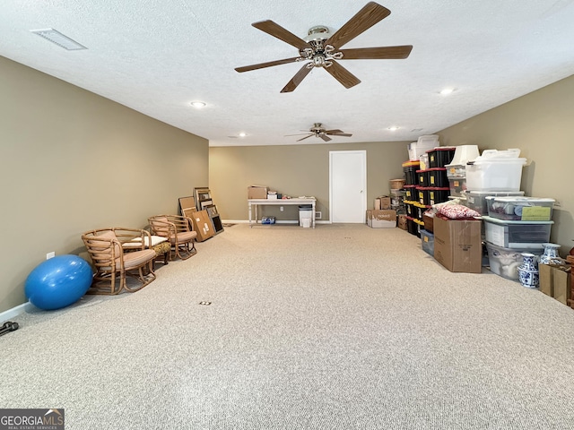 interior space featuring a textured ceiling and light colored carpet